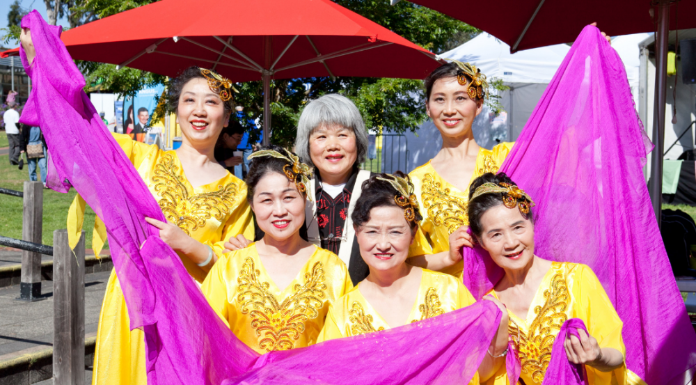 Asian traditional female dance group in costumes