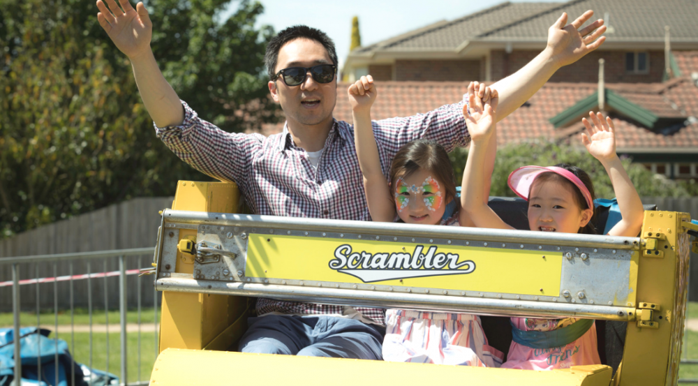 a man and two young girls on a ride