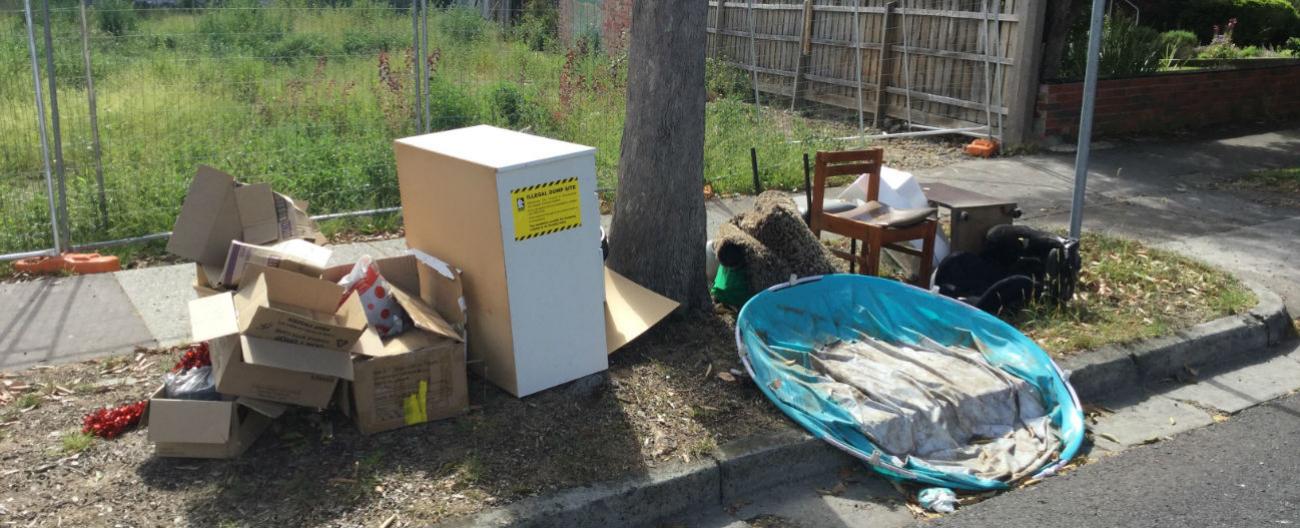 Dumped rubbish in front of vacant block