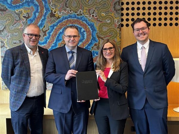 people standing and smiling at the camera