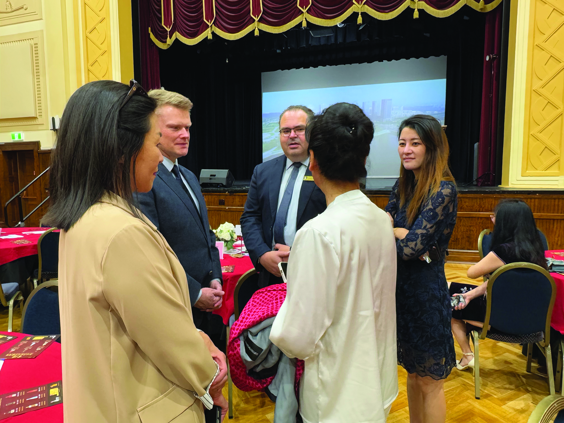 Mayor Cr Andrew Davenport speaking with attendees at a Lunar New Year event