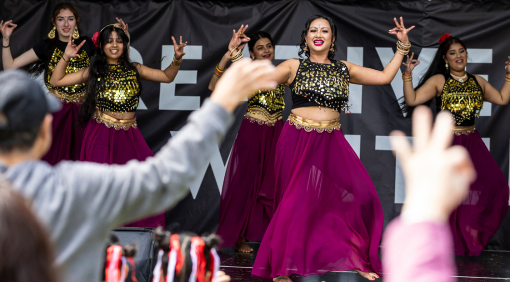 group of women dancing in costume