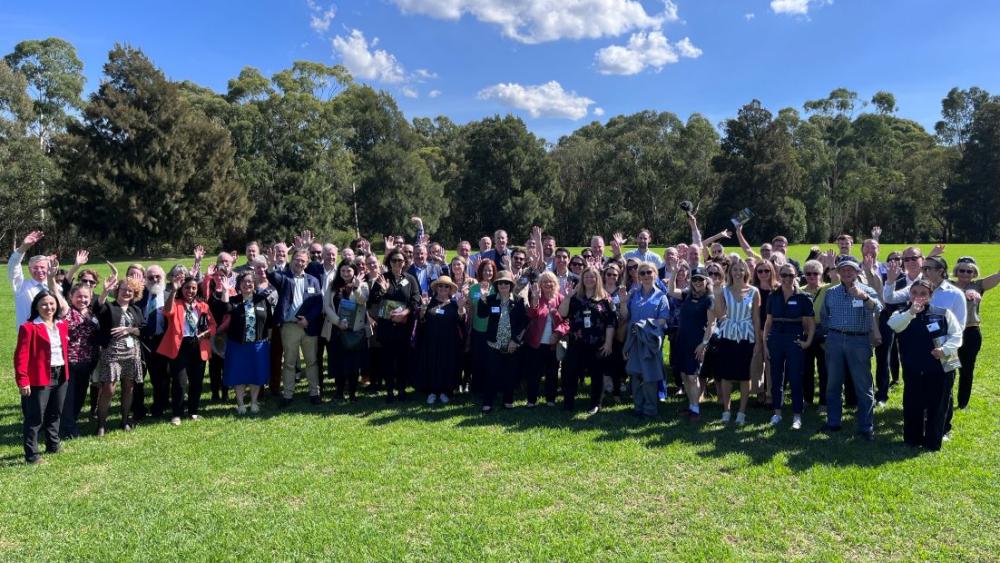 Group image of attendees of GCRC standing outside in a grassed area