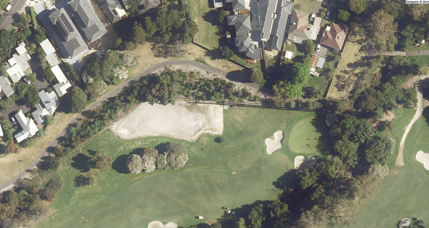 Aerial image of Gardiners Creek showing planted area, golf greens and residential housing