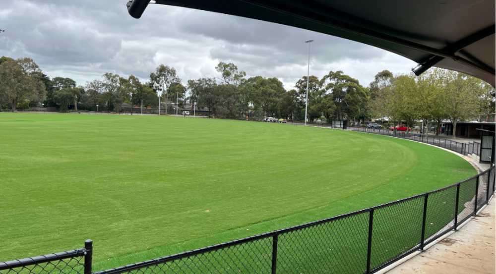 Football oval with black fence