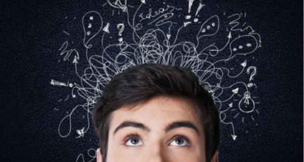 Young man looking up with drawings of the ideas in his mind above