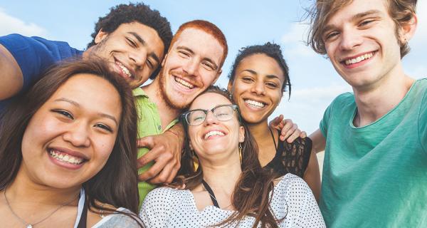 A group of young adults taking a selfie