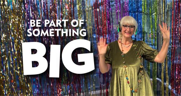 Senior lady in green top silent disco dancing