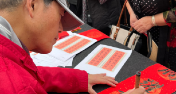 Man doing Chinese calligraphy