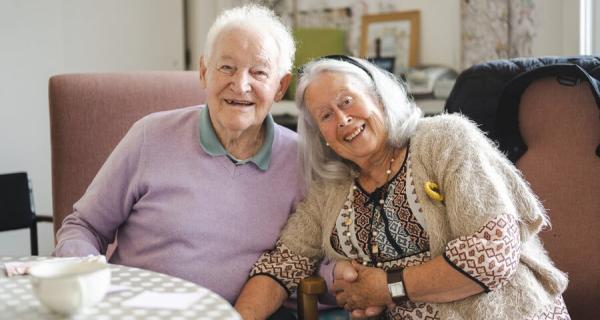 Older male and female at table
