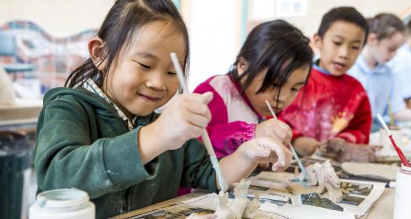 Kids making clay keepsakes 