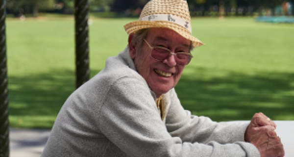 Man sitting at park bench