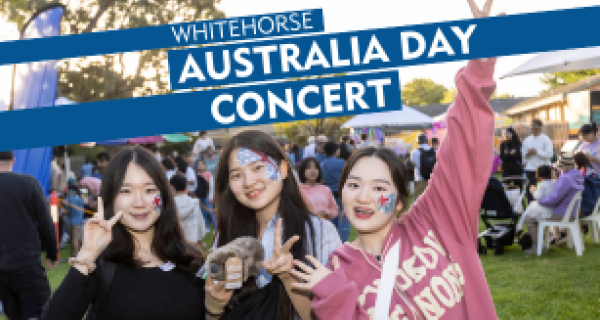 3 young women smiling at the camera displaying peace signs