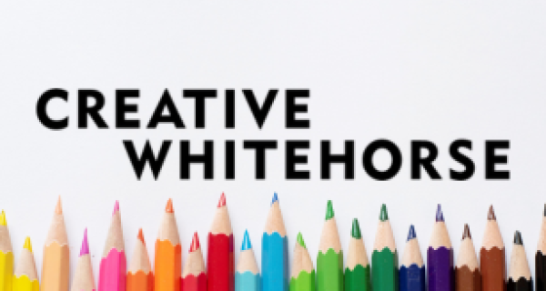 Creative Whitehorse text with coloured pencils in rainbow order on the bottom of the graphic