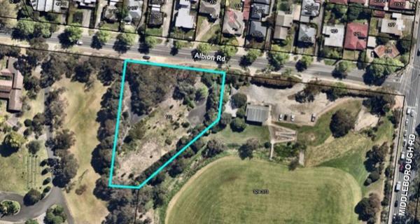 Image of Box Hill from above with outline of a vacant block of land in blue.