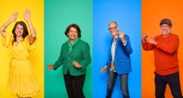 4 older people smiling and posing for the camera in bright colourful outfits