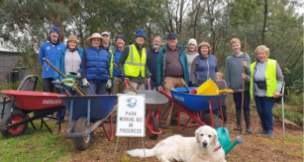 Val (on the far right) with her dog Corrie at a recent working bee.