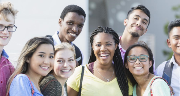 Group of diverse young people hanging out together