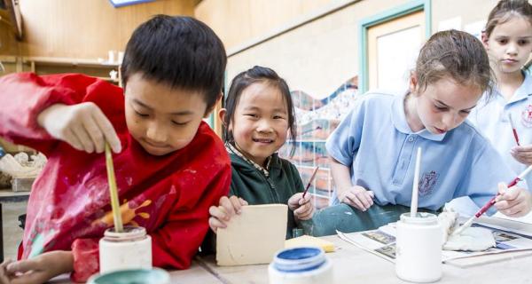 Kids creating clay sculptures 