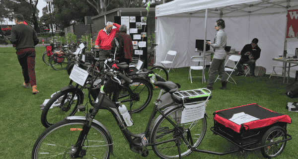 Electric bike expo seniors looking at expo stall tent