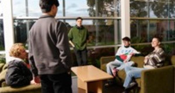 Group of young people having a relaxed discussion