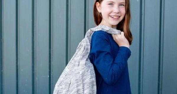 girl holding fabric