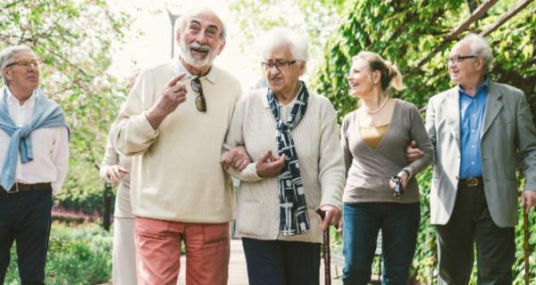 Six older people taking a walk together