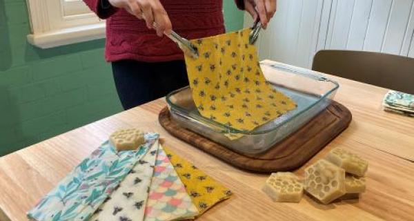 person making beeswax wraps 
