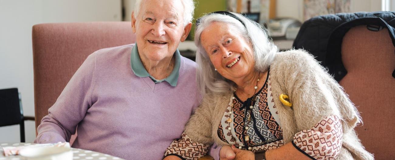 older Man and Women sitting next to each other 