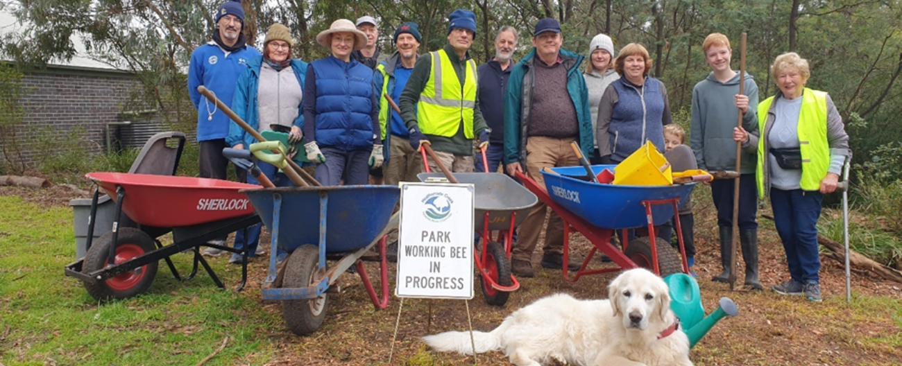 Val (on the far right) with her dog Corrie at a recent working bee.