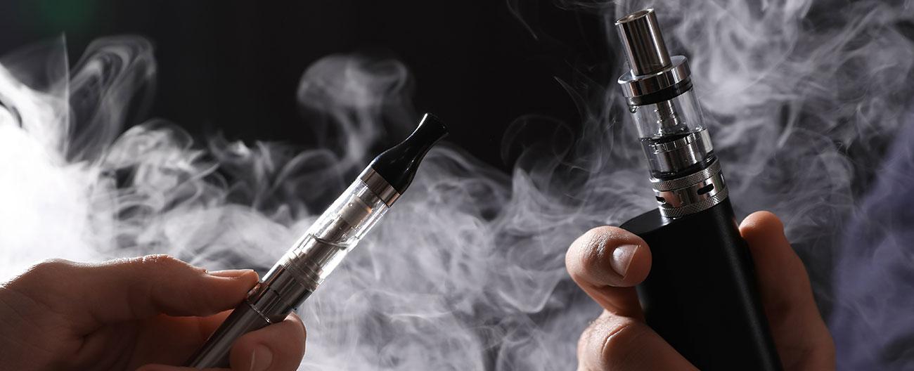 e-cigarettes with vaping cloud in background