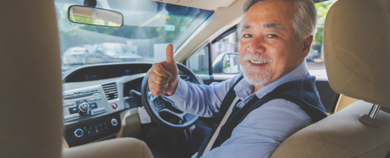 man sitting in the drivers seat of a car