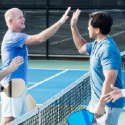 Men playing pickleball